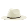 Detail of cream straw fedora hat featuring a brown leather band and bull metal emblem - Creamy White