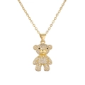 Detailed view of a gold-plated teddy bear pendant necklace with sparkling crystal inlay - White