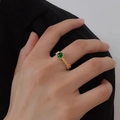 Vintage gold woven open ring with a vibrant green round cabochon gemstone centerpiece - Green Cabochon