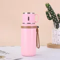 Pink matte stainless steel vacuum insulated bottle with a brown portable strap handle - 600ml / Pink
