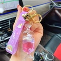 Pink candy liquid unicorn keychain with purple wrist strap and golden bell charm - Purple-Fruit Candy Unicorn