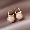 Close-up of champagne pink pearl earrings on pink silk with gold plated hoop details - Gold Pink