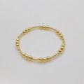 Dettaglio del bracciale elastico con perline placcate in oro 18K di varie dimensioni - 3mm+5mm Perline Tonde-Oro
