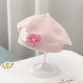 Pink knitted baby beret featuring handmade crochet flowers on a white display stand - Double Flower Knit Beret / Pink