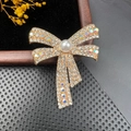 Elegant gold bow brooch with sparkling crystals and a large white pearl center - BZ008 AB Crystal Bowknot