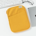 Detail view of yellow 11 inch tablet sleeve with front pocket and white brand label - 13" / Orange