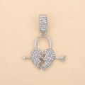 Macro shot of silver iced out broken heart pendant with arrow and sparkling crystals - Silver Heart Lock (Crown)