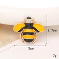 Detailed view of yellow bee charm with dimensions 2.7x3cm showing enamel and rhinestones - Gold Black Body Yellow Wing Bee