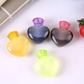Set of four heart-shaped mini sauce bottles with colorful lids for bento lunches - Colorful Heart Bottles Set of 4