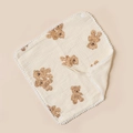 Detailed view of baby cotton bib with brown teddy bear print and white pom-pom trim - Double Bears And Beige