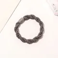 Detailed view of deep grey twisted cord hair tie with a smooth resin cylinder clasp - Braided Twist - Plastic Buckle / Gray