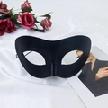 Classic black satin half-face masquerade mask on elegant white fabric background - Black