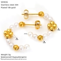 Detail view of 18k gold plated C-shaped earrings with pearls and clover charms - Clover Style (SE903G)