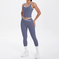 Detail of high-waist yoga pants with V-shaped crossover waist and white contrast binding - Blue Gray