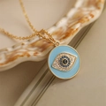 Goldene Halskette mit blauem Emaille-Böse-Augen-Anhänger und funkelnden Mikrokristallen - Runder Anhänger / Blau (Rund)