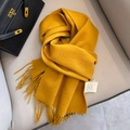 Ginger yellow 100% Australian wool scarf featuring elegant fringe and plush knit texture - Turmeric