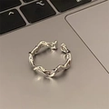 Minimalist silver twisted open ring for women with adjustable size on laptop background - Silver Mountain Open (JZ0600)