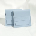 Elegant light blue PU leather jewelry pouch with flap closure and embossed brand strap - 8*8cm / Blue