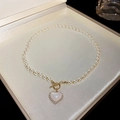 Detail of heart pendant necklace with pearls, shell inlay and golden toggle clasp - 12# White Heart Pendant Necklace