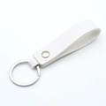 White PU leather keychain with metallic ring and rivet in a minimalist modern style - White & Silver
