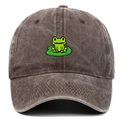 Detailed close-up of green frog embroidery on a vintage washed cotton baseball cap - Coffee