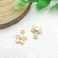 Golden flower-shaped metal pendants with textured detail for DIY jewelry making - 1pc Small Flower Charm