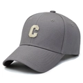 Grey cotton baseball cap with cream letter C embroidery shown in a side 45-degree angle - Gray