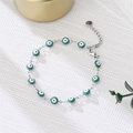 Detailed shot of teal enamel evil eye bracelet with lobster clasp and extension chain - Cyan Eyes Silver