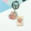 Cartoon acrylic keychain featuring a brown bear with a strawberry and matching tag - Strawberry Bear Style (Double Buckle No. 1)