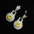 Macro shot of teardrop yellow crystal earrings with zircon accents on black velvet background - Yellow Diamond Earrings Tz-30