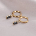 Gold hoop earrings featuring a black rectangular gemstone drop on pink silk fabric - 14K Gold Black Zirconia
