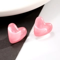 Macro shot of pink heart-shaped stud earring with cat eye stone texture on stylish base - Pink (Z-368)