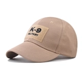 Close-up of the K-9 Military embroidery and durable khaki ripstop fabric on this baseball cap - Adjustable / Khaki