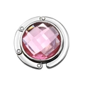Detail of pink crystal folding handbag hook with silver metal polished casing for table - Pink