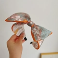 Fashionable orange-trimmed grey floral print wide headband with large bow detail - Orange Mythic Print Bow Headband