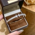 Silver H-shaped bracelet with cubic zirconia in a brown gift box on wooden table - Double H Style / Silver
