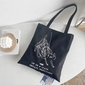 Black canvas tote bag featuring white abstract cat doodle print and artistic text - Cat Line Art Print / Black