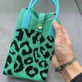Knitted turquoise phone tote bag featuring black leopard pattern and blue round handle - Leopard Green