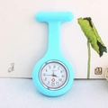 Close-up of a light blue silicone nurse watch featuring a quartz dial and medical cross - Light Blue