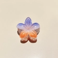 Macro detail of Frangipani hair claw with gradient purple-to-orange pearlescent finish - Colorful Plumeria Orange Purple