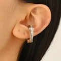 Close-up of silver paperclip earring with unique irregular molten lava texture on model - Textured Lava Style Earring (6757)