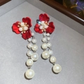 Detail of red flower earrings with gold diamond setting and elegant pearl tassels - Red Flower Pearl Tassel Earrings