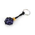 Macro detail of blue natural stone in a black handmade woven net bag keychain - Black Rope + Blue Sodalite