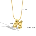 Detail view of a 3D bubble letter M necklace in gold with 45cm chain and dimensions - Letter M