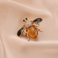 Cute golden honey bee brooch with amber gemstone, white rhinestones and black enamel finish - Style 1