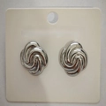 Silver twisted spiral knot earrings in high-polish finish on jewelry display card - Oval Swirl / Steel