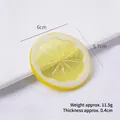Lifelike yellow PVC lemon slice keychain accessory showing pulp texture and white veins - 6cm Medium Yellow Lemon Slice - No Buckle