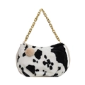 Faux fur cow print tote bag with golden metal chain strap and decorative pom pom - Black Cow Print