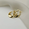 Macro shot of gold S925 silver irregular twisted earrings with hallmark detail - S-E1643-Gold Wavy