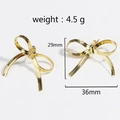 Elegant gold bow earrings for women featuring 29mm height and 36mm width dimensions - Gold